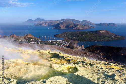 Panoramic view from Vulcano island crater with yellow sulfur fumaroles looking at Lipari Italy