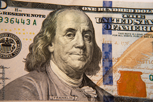 Obraz na plátně Close up of one hundred dollar bill with Benjamin Franklin portrait, macro shot of US currency