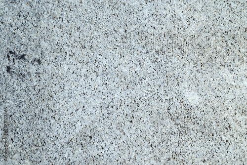Obraz na płótnie Light gray granite texture with fine black mineral speckles and natural crystalline surface