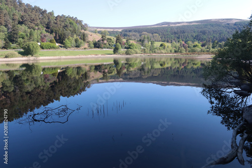 Calm water in a mountain lake on a spring day, Ireland
