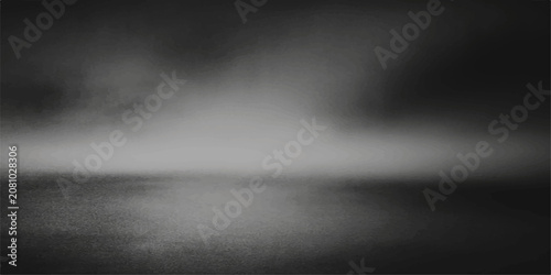 фотографія misty lake with eerie low cloud formation above the reflective water surface in monochrome
