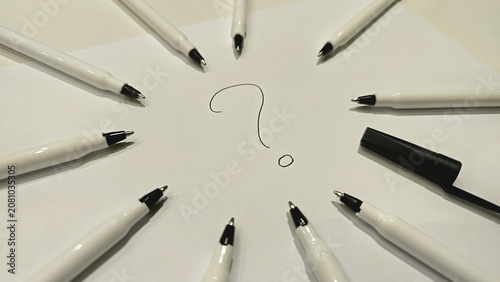 Creative Question Mark Design with Pens on White Paper