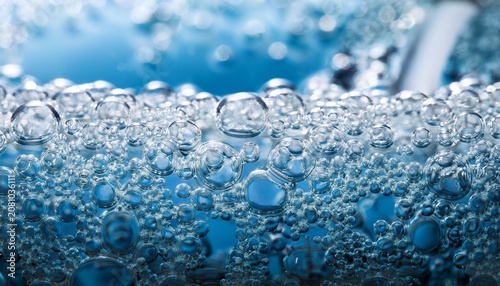 macro view of water purification technologies showing clear liquid flowing through porous foam filter membrane for absorption creating clean feeling of purity and innovation