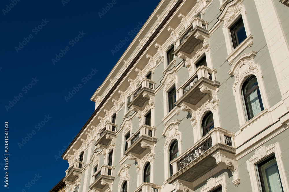 Obraz premium Elegant historic building facade in Via Nassa Lugano under blue sky
