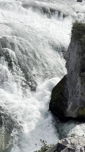 SCHAFFHAUSEN, SWITZERLAND - OCTOBER 11, 2025: View of the Rhine Falls with the powerful Rhine River flowing through the famous natural landmark.