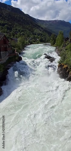Bovra River waterfall cascading into the Otta River in Lom, Norway