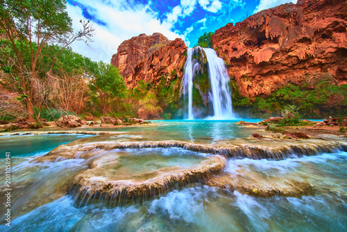 Bild auf Leinwand Havasu Falls Turquoise Waterfall in Arizona with Red Canyon Cliffs and Travertin