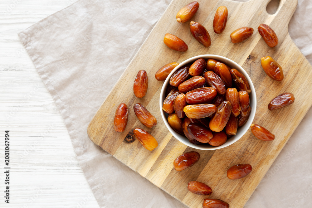 Fototapeta premium Algerian Dates Deglet Nour in a Bowl, top view. Copy space.