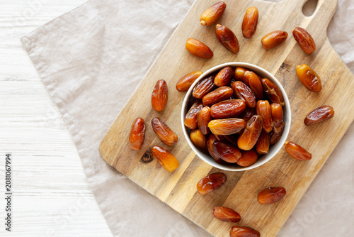 Algerian Dates Deglet Nour in a Bowl, top view. Copy space.