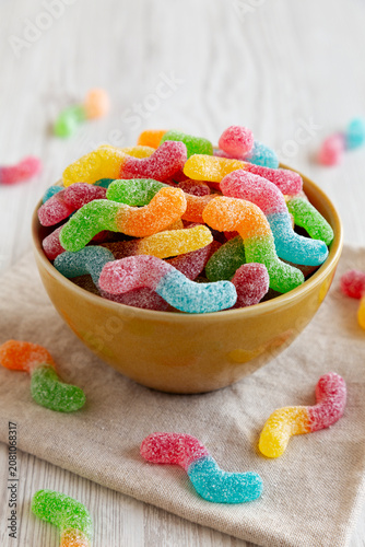 Sugary Sour Gummy Worms in a Bowl, side view.