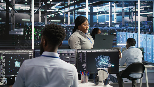 Photos Annoyed data infrastructure center IT specialist having faulty equipment