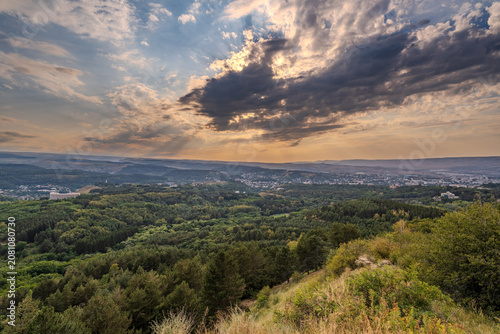 View of the mountains and Kislovodsk from the observation decks of the Kislovodsk Park. Evening sunset over the mountains of Kislovodsk.