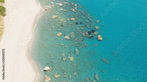 Rocky transparent waters in Calabria in the Mediterranean Sea in summer season