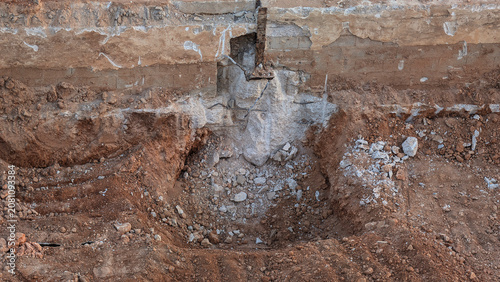 Cuadro en lienzo Exposed concrete foundation and excavated ground during structural demolition and site preparation