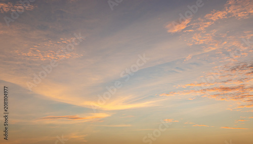Konstfotografi Beautiful sunset sky background with soft pastel orange light and dramatic golde