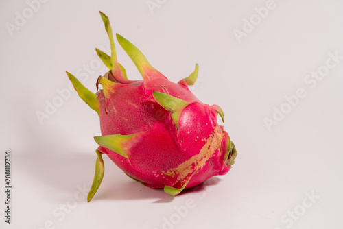 Fresh whole dragon fruit isolated on a white background. ideal for healthy eating, organic food, and exotic fruit concepts.