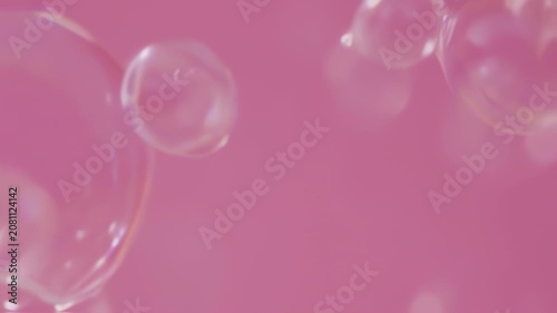 Bubbles floating against a soft, pink backdrop. Shapes are distorted and out of focus