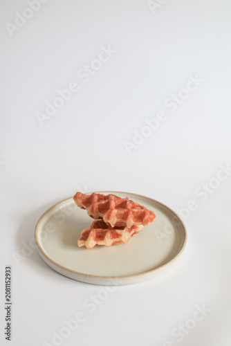 Croffle or Croissant Waffle on modern plate a delicious fusion of classic pastries promising delightful sweet treat for any occasion.