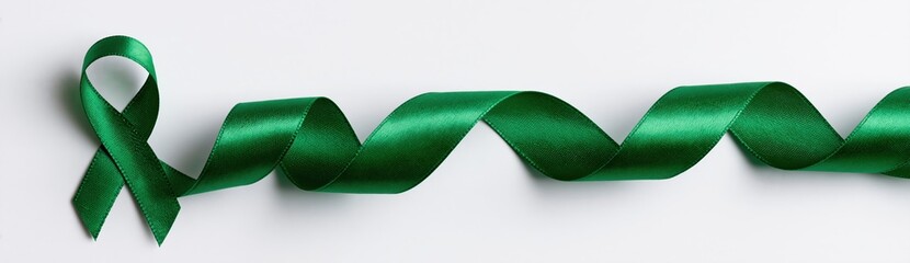 Green satin ribbon awareness loop symbol for medical health support and solidarity