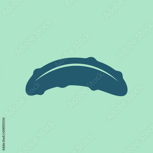 A dark blue cucumber silhouette on a mint green background