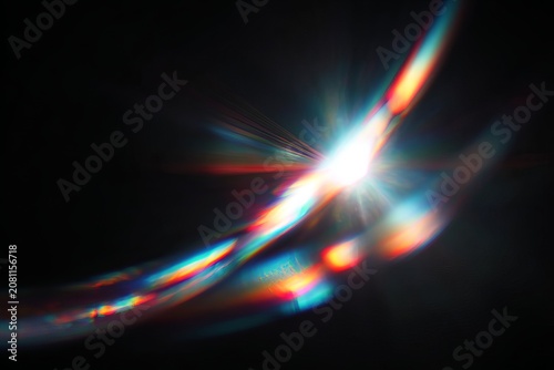 Prismatic Light Flare on Black Background - A Captivating Optical Phenomenon.