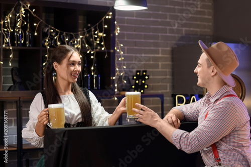 Young happy couple in tradi...