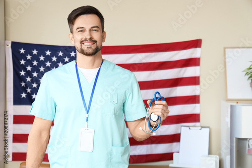 Male doctor with stethoscop...