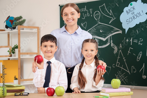 Female teacher and little s...