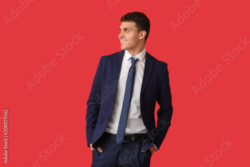 Smiling young man with styl...