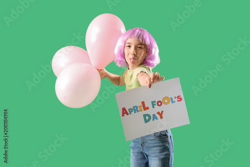 Funny little girl in wig wi...
