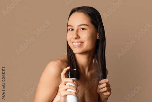 Young woman with cosmetics ...