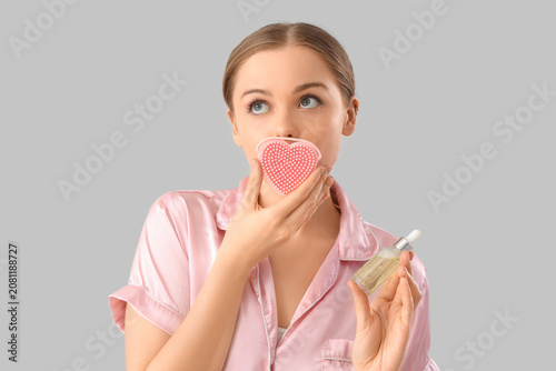 Young woman in pajamas with...