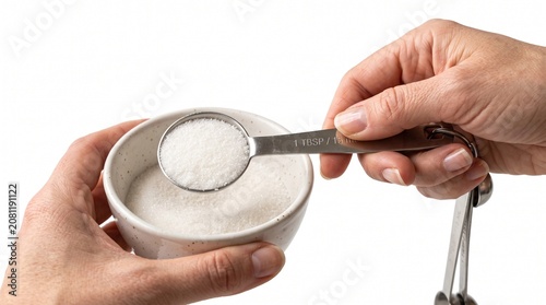 Photorealistic close-up hands measuring ingredients with spoons, cooking prep, isolated on pure white background