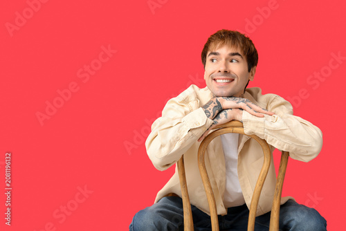 Happy handsome young tattoo...
