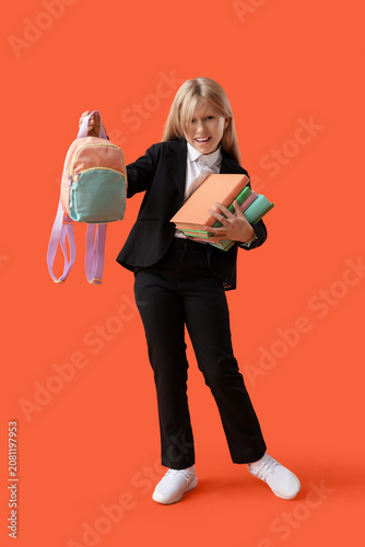 Upset little schoolgirl wit...