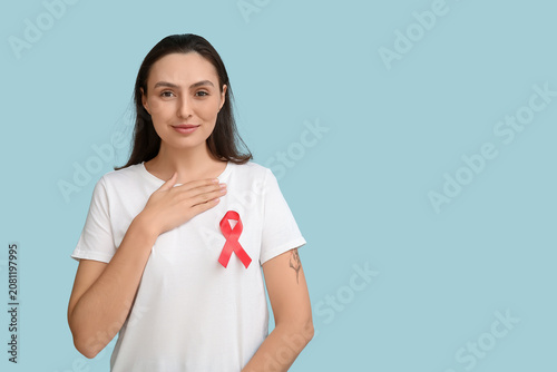 Young woman with red ribbon...