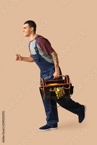 Male car mechanic with tool...