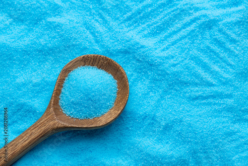 Fotografie Bright blue copper sulfate in a spoon - Blue sea salt