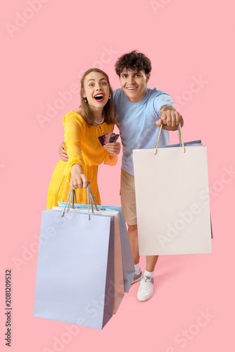Happy young couple with cre...