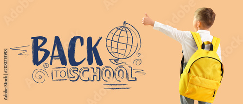 Little student with backpac...