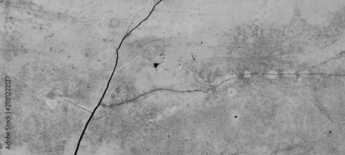 Cracked gray concrete surface texture with weathered cement pattern