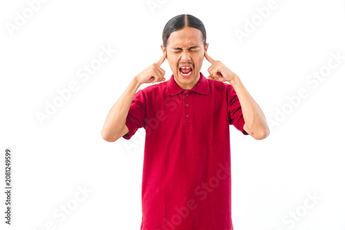 Photography Close-up portrait of an angry Asian man with long hair wearing a red shirt, making a frustration gesture against a white background