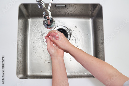Photography Woman washing hands with antibacterial soap for corona virus prevention, hygiene