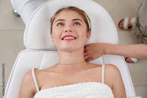 Quadro su tela Closeup of relaxed young woman laying on table in spa center