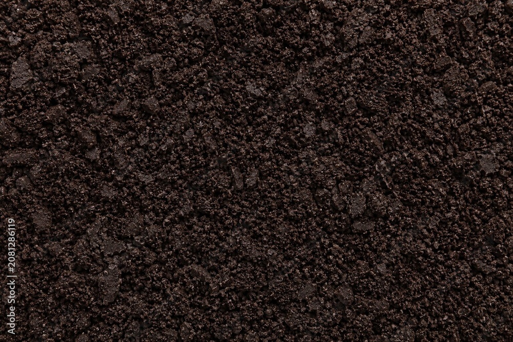 Fototapeta premium Dark Cookies Crumb Dessert Topping Background. Dessert Topping Background