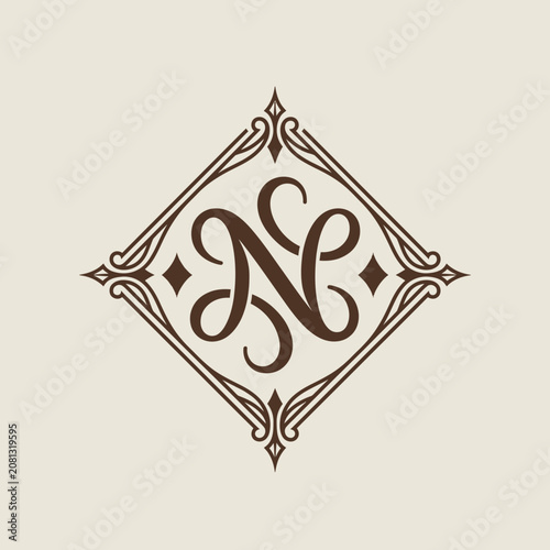 Elegant ornate monogram logo in decorative diamond frame.