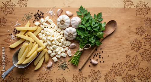 Poutine ingredients on canada pine wood with maple etching, 