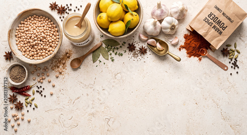 Dried chickpeas and tahini on authentic Jerusalem limestone stone, 