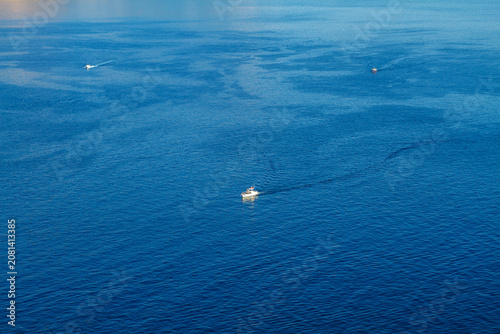 Obraz na plátně Aerial View of Motor Boats With Foamy Wakes on Blue Sea