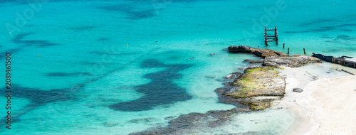 Photos Aerial view of sandy beach, remains of old pier and ocean with small waves in Cancun, Mexico